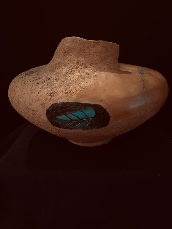 6" x 10" textured and burnished, Raku vase with horse hair and glass leaf